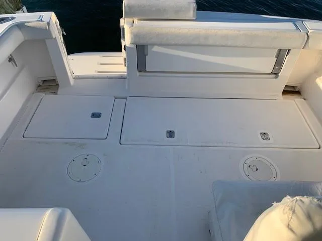 Mickadoo Yacht Photos Pics 2001 Tiara Yachts 3100 deck with storage compartments and seating, viewed from above.