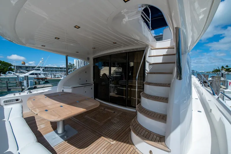My Sirena Yacht Photos Pics Luxurious 2008 Sunseeker Manhattan 70 yacht with elegant deck and spiral staircase.
