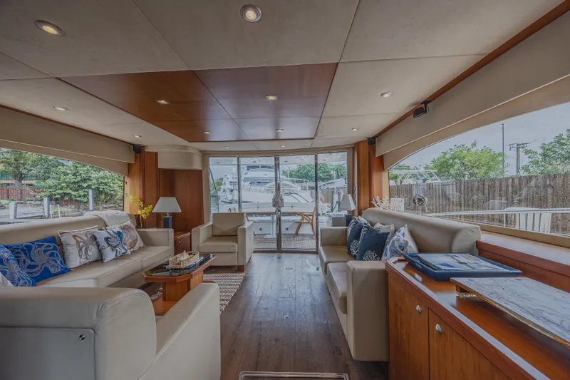 My Sirena Yacht Photos Pics Luxurious interior of 2008 Sunseeker Manhattan 70 yacht with elegant seating and large windows.