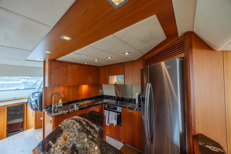 My Sirena Yacht Photos Pics Luxurious kitchen interior of 2008 Sunseeker Manhattan 70 yacht with modern appliances.