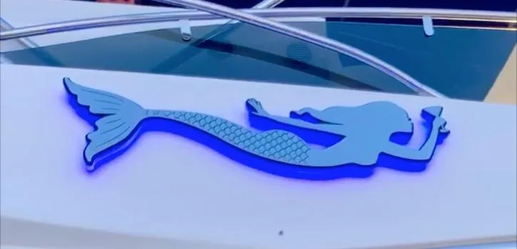 My Sirena Yacht Photos Pics Mermaid emblem on 2008 Sunseeker Manhattan 70 yacht, featuring sleek design and vibrant blue color.