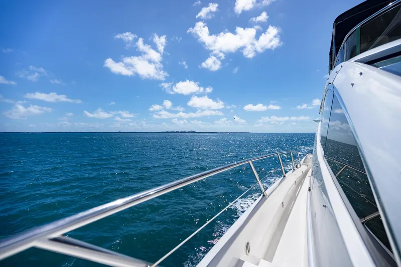 My Sirena Yacht Photos Pics Sunseeker Manhattan 70 yacht cruising on a sunny ocean, 2008 model.