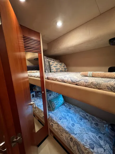 My Sirena Yacht Photos Pics 2008 Sunseeker Manhattan 70 yacht cabin with bunk beds and cozy decor.