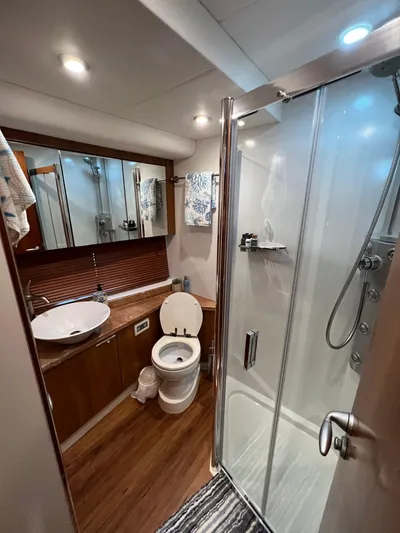 My Sirena Yacht Photos Pics Luxurious bathroom in 2008 Sunseeker Manhattan 70 yacht with modern fixtures and shower.