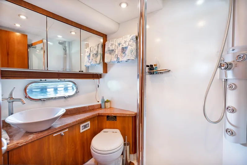 My Sirena Yacht Photos Pics Luxurious bathroom in 2008 Sunseeker Manhattan 70 yacht with modern fixtures and elegant design.