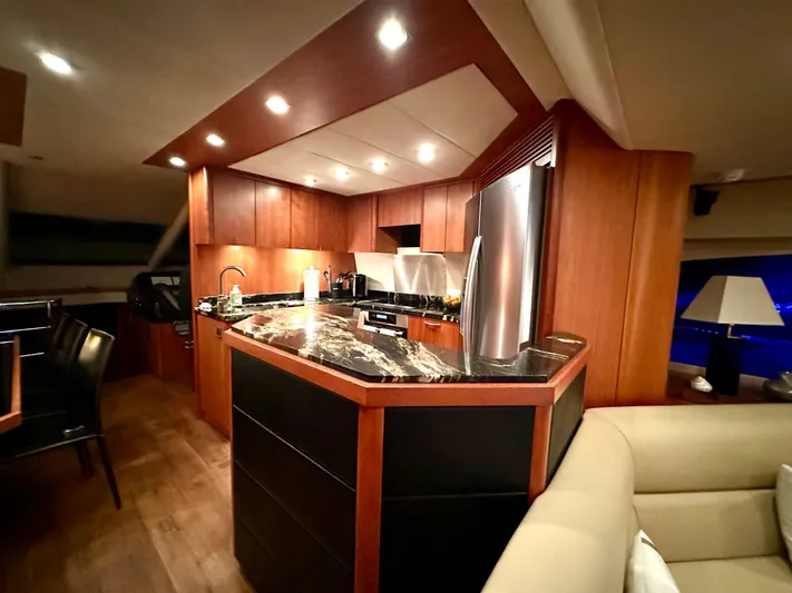 My Sirena Yacht Photos Pics Luxurious kitchen interior of 2008 Sunseeker Manhattan 70 yacht with modern amenities.