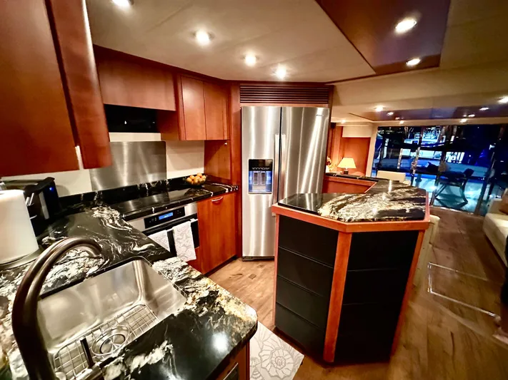 My Sirena Yacht Photos Pics Luxurious kitchen interior of 2008 Sunseeker Manhattan 70 yacht with modern appliances.
