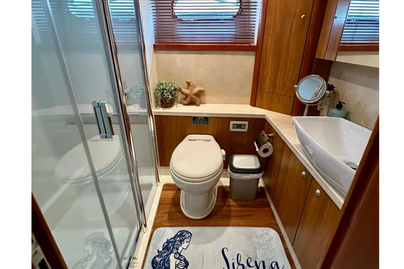 My Sirena Yacht Photos Pics Luxurious bathroom in 2008 Sunseeker Manhattan 70 yacht with modern fixtures and elegant decor.