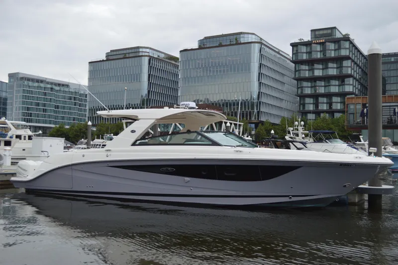 La Santa Yacht Photos Pics 2019 Sea Ray SLX 400 Outboard yacht docked in urban marina, modern buildings in background.