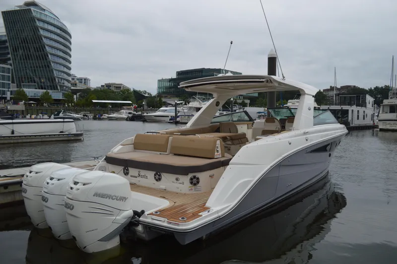 La Santa Yacht Photos Pics 2019 Sea Ray SLX 400 Outboard boat docked in a marina, featuring triple Mercury engines.