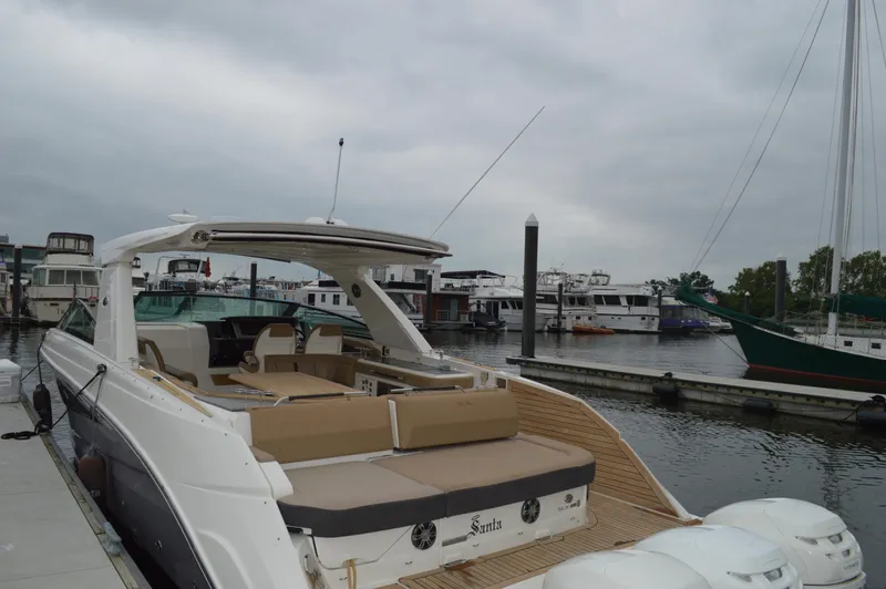 La Santa Yacht Photos Pics 2019 Sea Ray SLX 400 Outboard docked at marina, featuring spacious seating and sleek design.