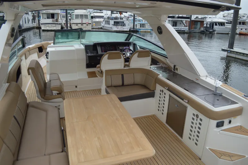La Santa Yacht Photos Pics 2019 Sea Ray SLX 400 Outboard interior with seating, table, and helm at marina.