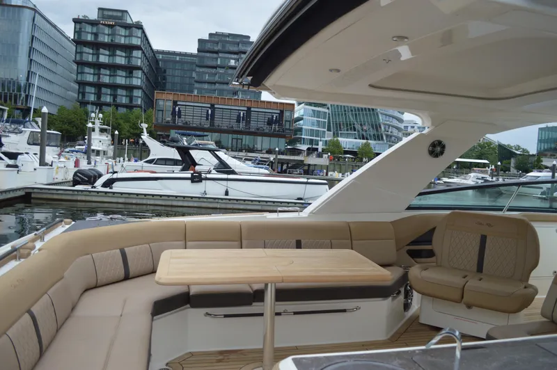 La Santa Yacht Photos Pics 2019 Sea Ray SLX 400 Outboard yacht interior with seating and table at a marina.