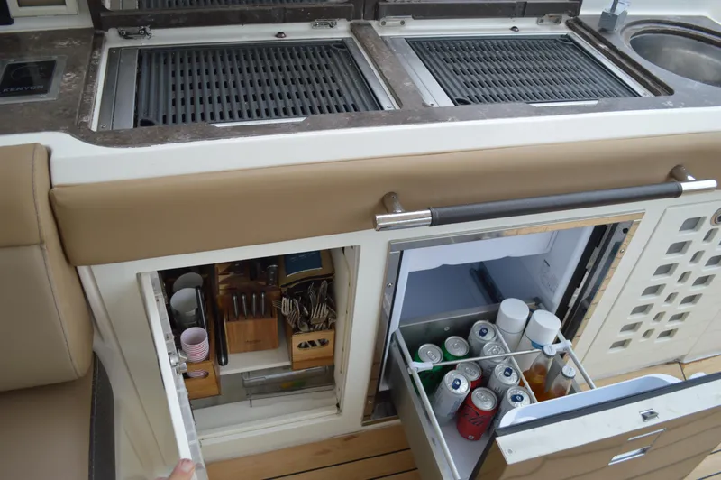 La Santa Yacht Photos Pics 2019 Sea Ray SLX 400 Outboard kitchen with grill, fridge, and storage drawers.