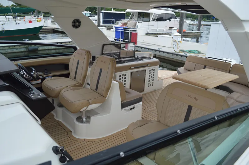 La Santa Yacht Photos Pics 2019 Sea Ray SLX 400 Outboard interior with luxurious seating and modern amenities at a marina.