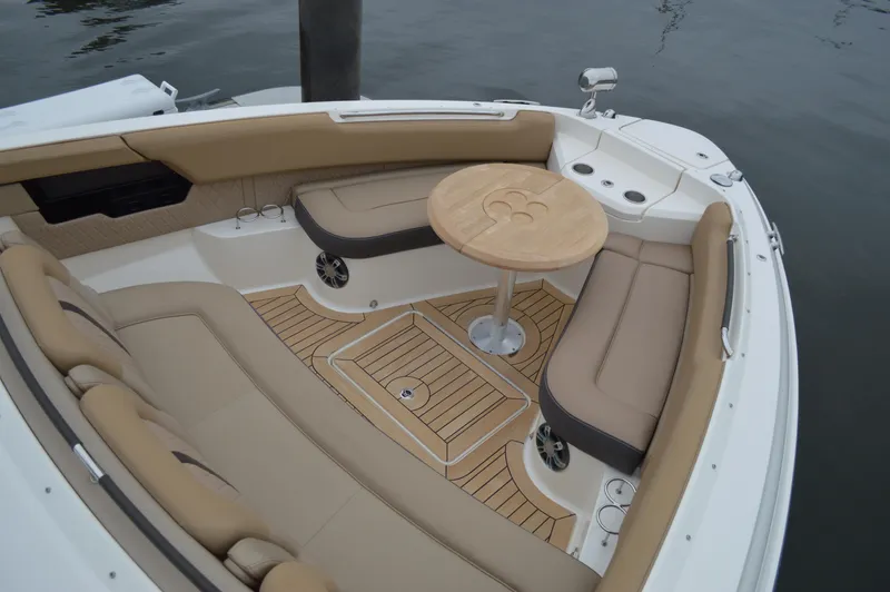 La Santa Yacht Photos Pics 2019 Sea Ray SLX 400 Outboard boat interior with tan seating and wooden table.
