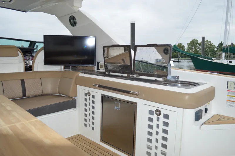 La Santa Yacht Photos Pics 2019 Sea Ray SLX 400 Outboard interior with seating, TV, and kitchenette.