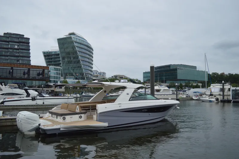 La Santa Yacht Photos Pics 2019 Sea Ray SLX 400 Outboard docked in modern marina with unique architecture.