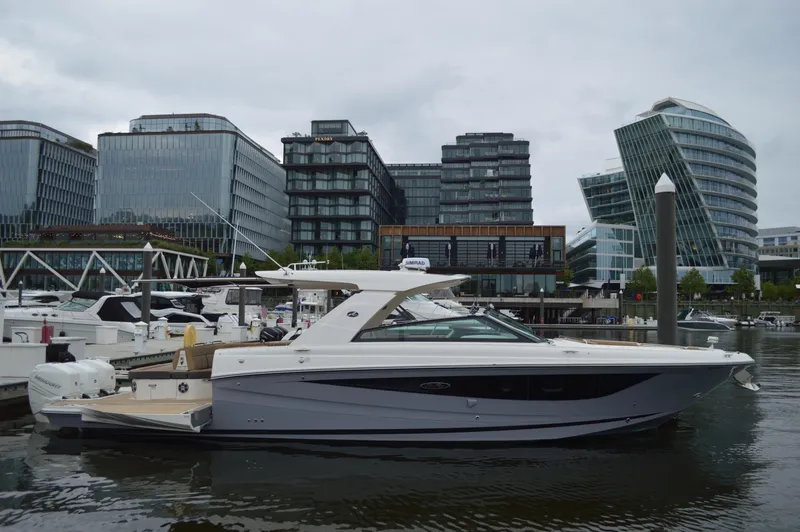 La Santa Yacht Photos Pics 2019 Sea Ray SLX 400 Outboard yacht docked in urban marina with modern buildings.