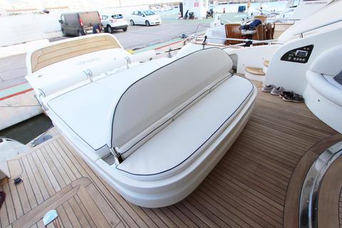 Luxury yacht deck with seating, AB 68 model, 2004, docked at marina.