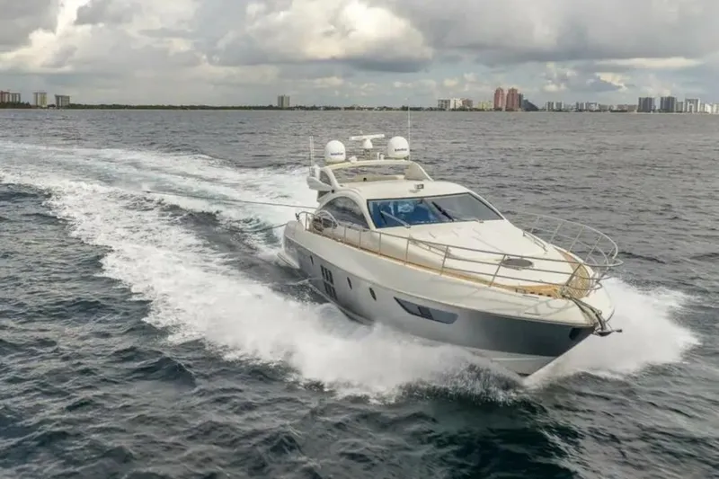 62 Azimut 62s Yacht Photos Pics 2008 Azimut 62S yacht cruising on open water under cloudy skies.