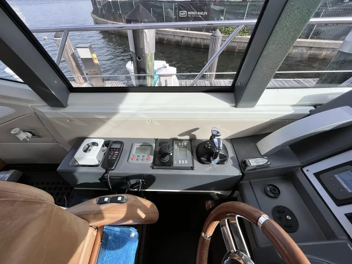 62 Azimut 62s Yacht Photos Pics Control panel of a 2008 Azimut 62S yacht, featuring navigation and steering equipment.