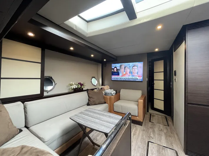 62 Azimut 62s Yacht Photos Pics Luxurious interior of 2008 Azimut 62S yacht with modern seating and TV.