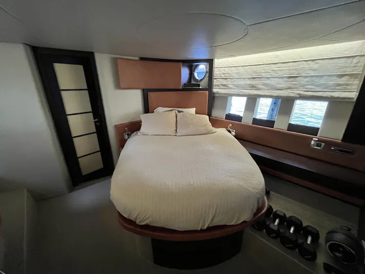 62 Azimut 62s Yacht Photos Pics Luxurious bedroom interior of 2008 Azimut 62S yacht with modern design and large windows.