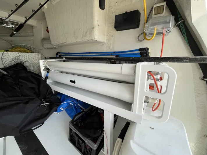 62 Azimut 62s Yacht Photos Pics Storage area on a 2008 Azimut 62S yacht with fishing gear and equipment.