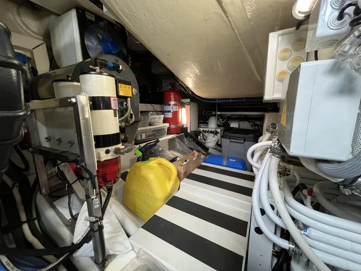 62 Azimut 62s Yacht Photos Pics Engine room of a 2008 Azimut 62S yacht, featuring equipment and storage.