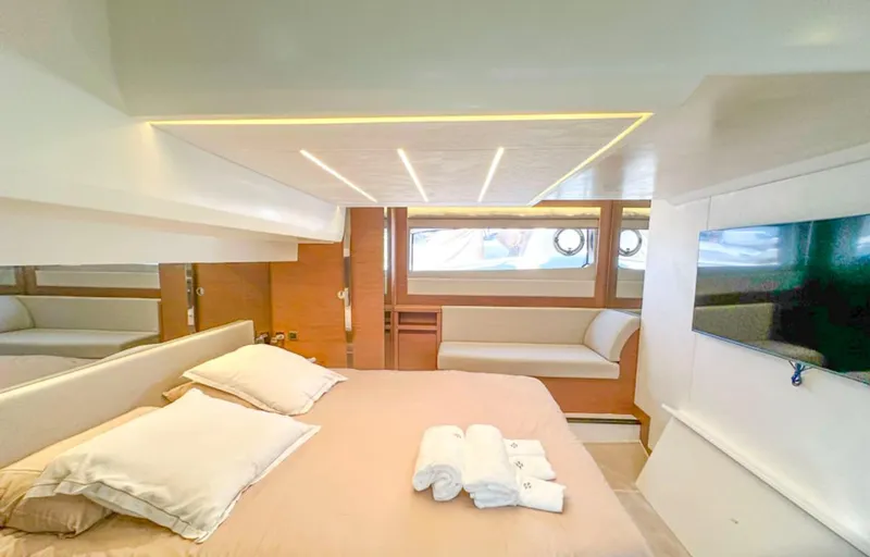  Yacht Photos Pics Luxurious bedroom interior of 2024 Prestige 520 Fly yacht with modern design and amenities.