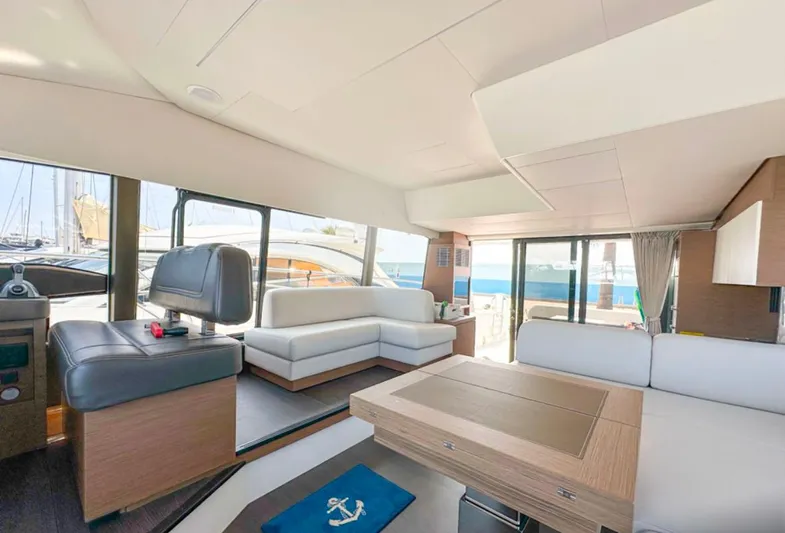  Yacht Photos Pics Luxurious interior of 2024 Prestige 520 Fly yacht with modern seating and panoramic windows.