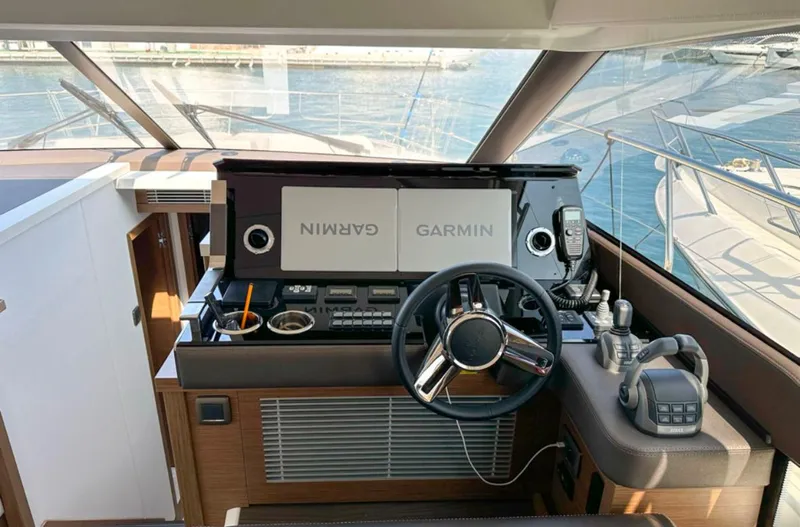  Yacht Photos Pics 2024 Prestige 520 Fly yacht helm with Garmin navigation system and modern controls.