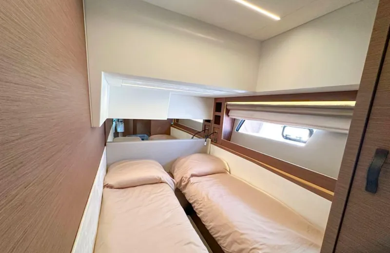  Yacht Photos Pics 2024 Prestige 520 Fly yacht cabin with twin beds, modern design, and natural light.