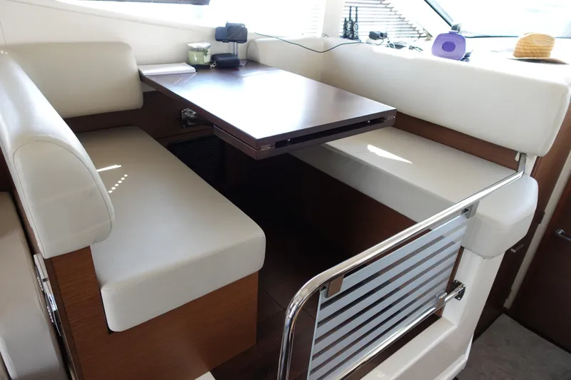  Yacht Photos Pics Interior seating area of 2012 Sea Ray 450 Sedan Bridge yacht with table.