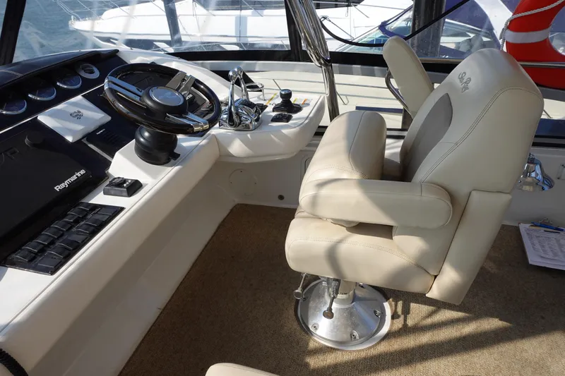  Yacht Photos Pics Captain's chair and helm of 2012 Sea Ray 450 Sedan Bridge yacht.