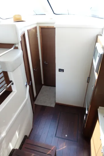  Yacht Photos Pics Interior view of 2012 Sea Ray 450 Sedan Bridge yacht with wooden flooring and modern design.