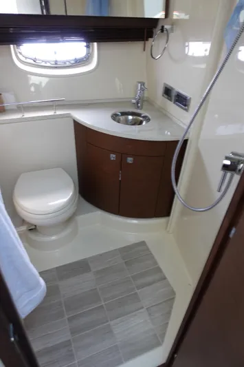  Yacht Photos Pics 2012 Sea Ray 450 Sedan Bridge bathroom with modern fixtures and compact design.