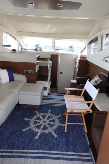  Yacht Photos Pics Interior of 2012 Sea Ray 450 Sedan Bridge yacht with modern seating and nautical decor.