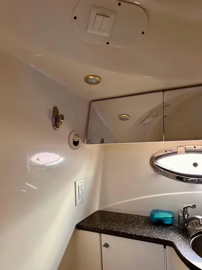  Yacht Photos Pics 2004 Formula 370 Super Sport bathroom interior with sink and mirror.