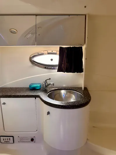  Yacht Photos Pics 2004 Formula 370 Super Sport yacht bathroom with sink and porthole window.