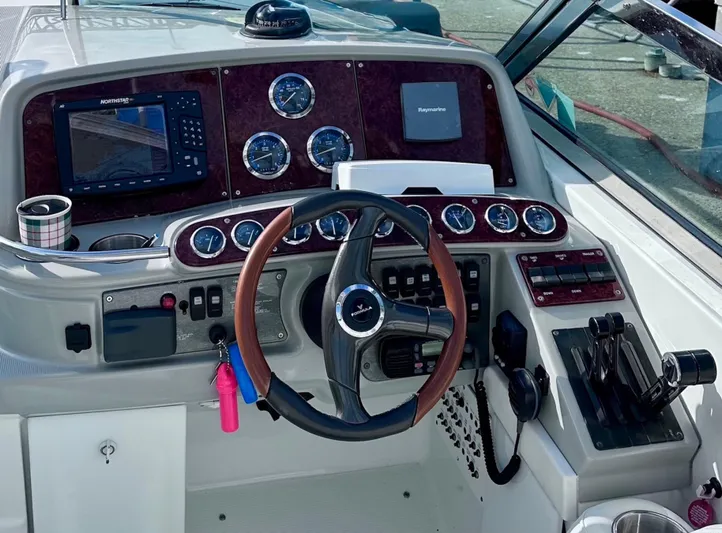  Yacht Photos Pics 2004 Formula 370 Super Sport boat dashboard with steering wheel and navigation instruments.