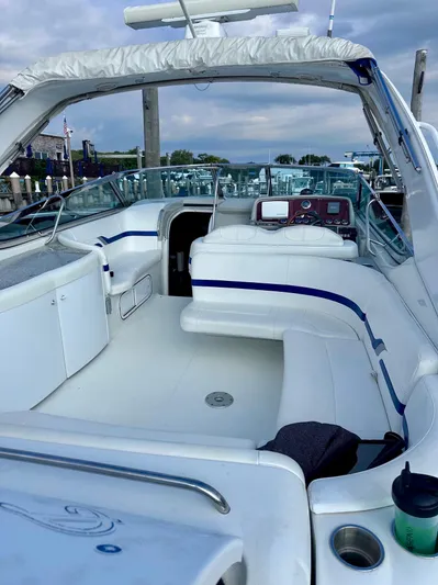  Yacht Photos Pics 2004 Formula 370 Super Sport boat with spacious white seating and modern dashboard.