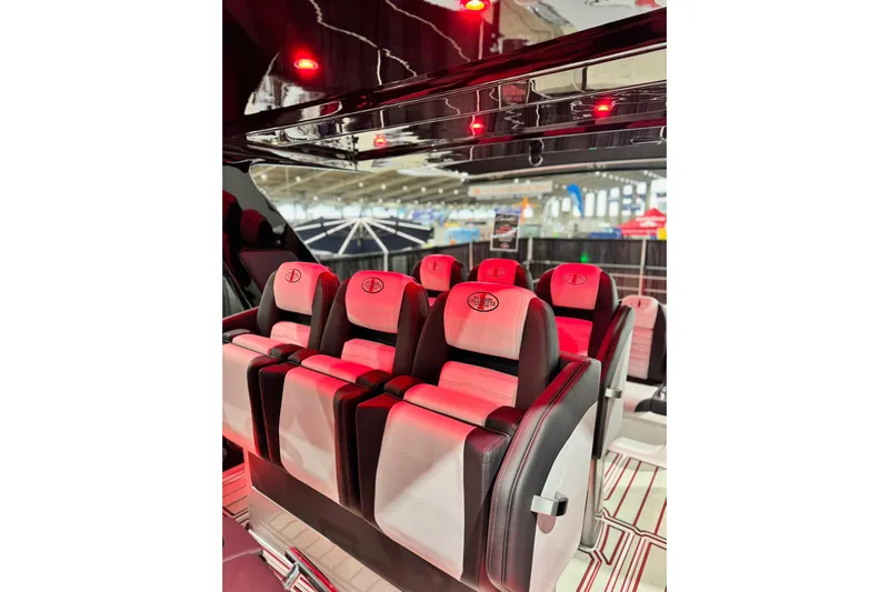  Yacht Photos Pics Luxurious interior of 2024 Cigarette 41' Nighthawk SD Edition with red ambient lighting.