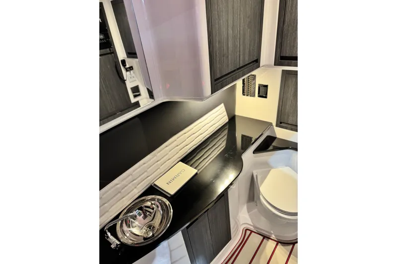  Yacht Photos Pics Luxurious interior of 2024 Cigarette 41' Nighthawk SD Edition boat, featuring sleek cabinetry.