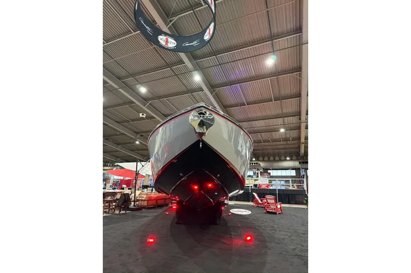  Yacht Photos Pics 2024 Cigarette 41' Nighthawk SD Edition boat displayed indoors with red lighting.