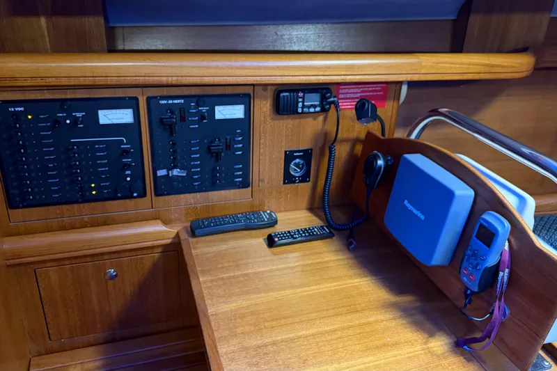 Nauti Cat Yacht Photos Pics Control panel of a 2005 Hunter 38 yacht with navigation and communication equipment.