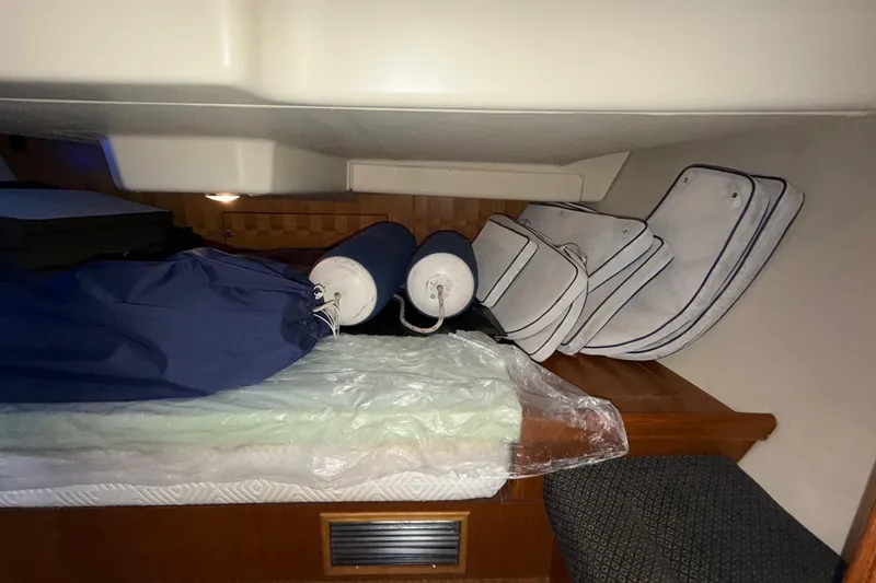 Nauti Cat Yacht Photos Pics Interior cabin of 2005 Hunter 38 sailboat with cushions and fenders.