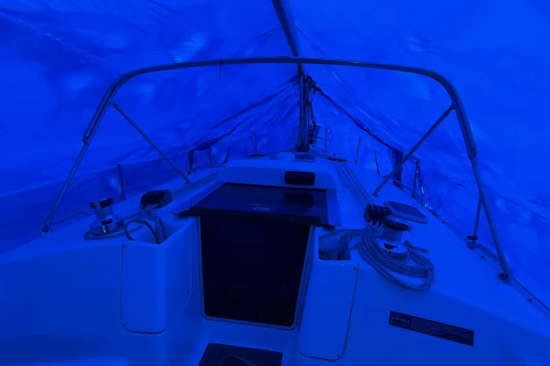 Nauti Cat Yacht Photos Pics Interior view of a 2005 Hunter 38 sailboat under blue tarp cover.
