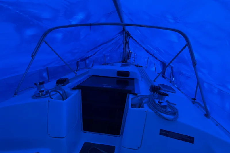 Nauti Cat Yacht Photos Pics Interior view of a 2005 Hunter 38 sailboat under blue tarp cover.